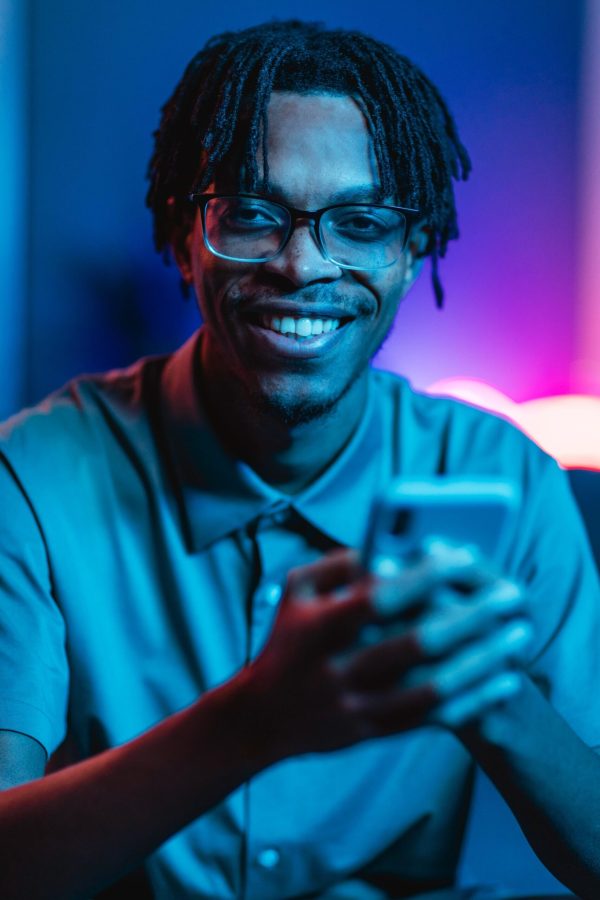 front-view-smiley-man-holding-smartphone-hands (1) (1) front-view-smiley-man-holding-smartphone-hands (1) (1)